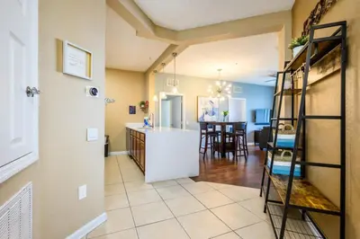 a kitchen and living room with a kitchen and a dining room at Beautiful Modern Condo, Near the Parks! - 3021 in Orlando