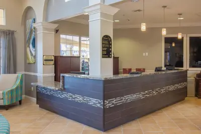 a restaurant with a blue counter in a lobby at Epic Universe NEW Beautiful Lakeview Condo Near the Parks - 1026 in Orlando