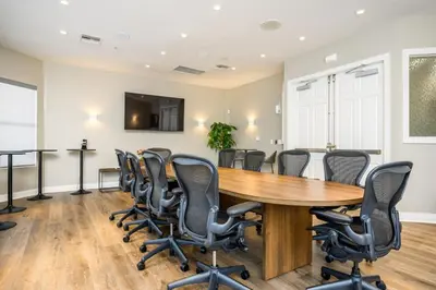 a conference room with a wooden table and chairs at Epic Universe 3 Bedroom Premium Lakeview Condo-1012 in Orlando