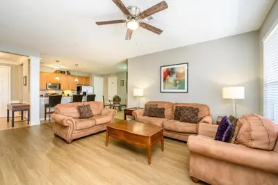 a living room with furniture and a ceiling fan at Epic Universe 3 Bedroom Premium Lakeview Condo-1012 in Orlando
