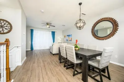 a dining room with a table and chairs at Epic Universe New Listing Beautiful Townhome, Vista Cay - 4019 in Orlando