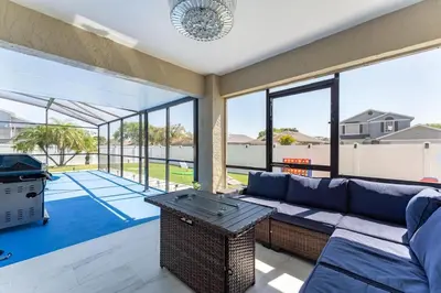 a living room with a couch and a table at Villa Resort Club in Kissimmee