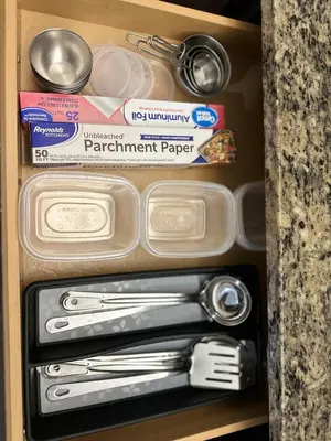 a drawer full of kitchen utensils in a cabinet at Orlando Bliss Near Disney in Orlando