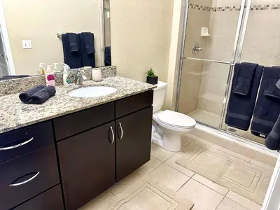 a bathroom with a sink and a shower and a toilet at Orlando Bliss Near Disney in Orlando