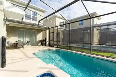 an image of a swimming pool in a house at Casa 5Q c/ Piscina e Temas da Disney in Kissimmee