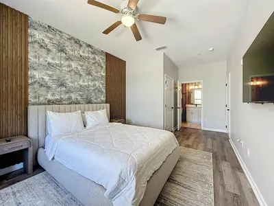 a bedroom with a bed and a ceiling fan at Beautiful Three bed condo, Minutes from Disney condo in Kissimmee
