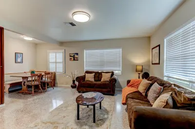 a living room with a couch and a table at Downtown Duplex B Private Yard Great Location in Sanford