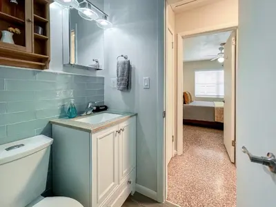 a bathroom with a sink and a toilet at Downtown Duplex B Private Yard Great Location in Sanford