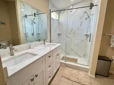 a bathroom with a large sink and a shower at 4701-Lake Berkley villa- Renovated 3 bed in Kissimmee