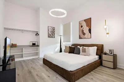 a bedroom with a bed and a television in it at Grand 15-Bedroom Villa -Magical Themes Pool & Game Loft Lakeview in Kissimmee