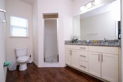 a bathroom with a toilet and a sink and a shower at Spacious 4Bd Disney Dream with Resort Access at Lucaya 3210 in Kissimmee