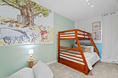 a bedroom with a bunk bed and a mural at Luxury Paradise in Orlando Best Location in Orlando