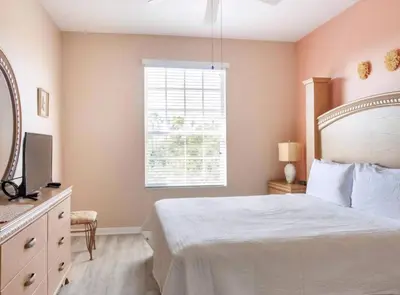 a bedroom with a large bed and a window at Making Memories At Windsor Palms Resort, Great Amenities And Much More Fun! in Kissimmee