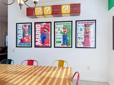 four pictures on a wall in a dining room at Free Water Park-Close to Disney-3 King-POOL-SPA in Orlando
