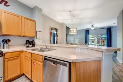 a kitchen with a sink and a dishwasher at Family Retreat Near Disney in Emerald Island in Kissimmee