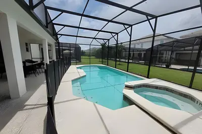 an indoor swimming pool in a house with a glass roof at Fantastic Large Pool,Sonoma Resort in Kissimmee