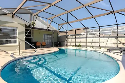 a large swimming pool with a glass roof at Lakeside View Pool Home, close to Disney, Malls in Kissimmee