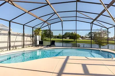an indoor swimming pool with a glass roof at Lakeside View Pool Home, close to Disney, Malls in Kissimmee