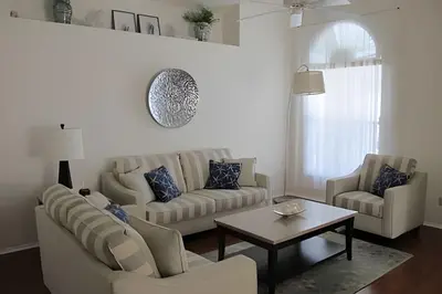 a living room with two couches and a coffee table at Premium Pool Villa Centrally Located near Disney in Kissimmee