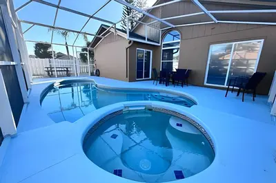 a swimming pool in the middle of a house at Corner Lot Pool Home Central Located near Disney in Kissimmee