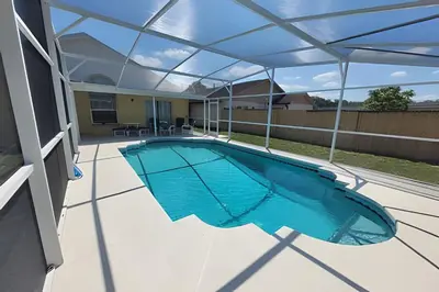 an overhead view of a swimming pool under a pergola at Huge Lot, Private Pool Home Centrally Located in Kissimmee