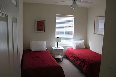a bedroom with two beds and a window at Encantada Resort, Pool, close to Disney in Kissimmee