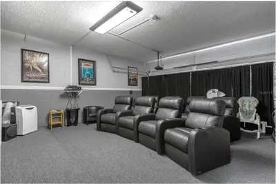 a waiting room with leather reclining chairs and a room with at 2767LKD-Emerald Island Resort home in Kissimmee