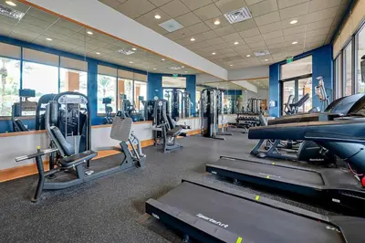 a gym with treadmills and cardio equipment in a building at Resort Access and Great Location in Orlando