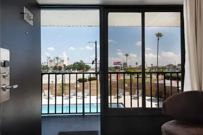 a view of a pool from a hotel room window at The Vietta Hotel in Kissimmee