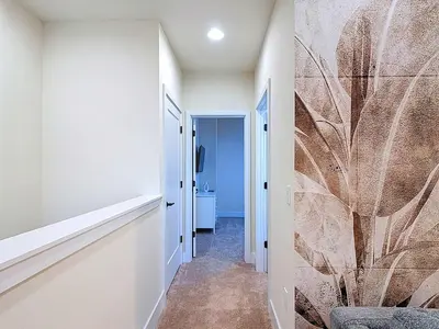 a hallway with a wall mural of a plant at Spacious 3BR with Clubhouses and Splash Fun in Orlando