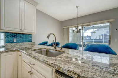 a kitchen with a sink and a window at Bay Pointe Pool Home Near Parks in Kissimmee
