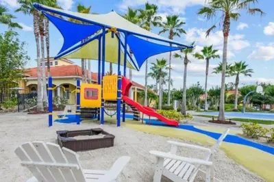 a playground at a resort with a slide at Magical 7BR Resort Pool Home Near Disney World in Kissimmee