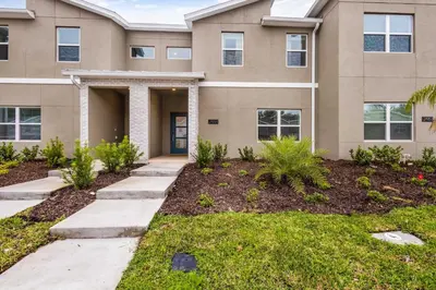 a house with a pathway in front of it at Stylish Family Retreat with Themed Bedrooms in Kissimmee