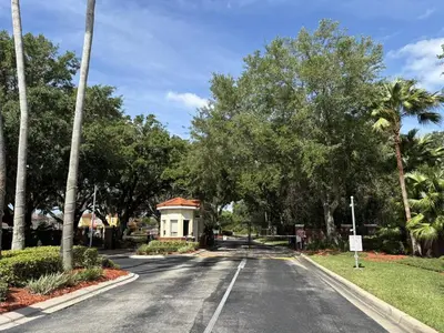 a street with a house on the side of the road at Relax and unwind in this Cozy Home Away from Home in Kissimmee