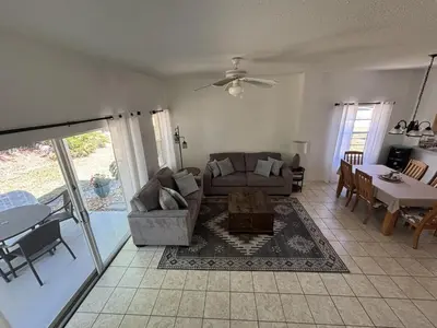 a living room with a couch and a table at Relax and unwind in this Cozy Home Away from Home in Kissimmee