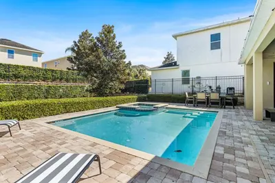 a swimming pool in the backyard of a house at Fantastic 6BR Themed Encore Home in Orlando