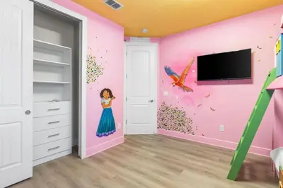 a bedroom with a pink wall with a girl painted on it at Fantastic 6BR Themed Encore Home in Orlando