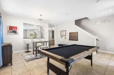 a living room with a pool table in it at Fantastic 6BR Themed Encore Home in Orlando