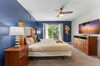 a bedroom with a bed and a ceiling fan at Disney-Area Kissimmee 3BR | Community Pool in Kissimmee