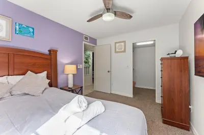 a bedroom with a bed and a ceiling fan at Disney-Area Kissimmee 3BR | Community Pool in Kissimmee
