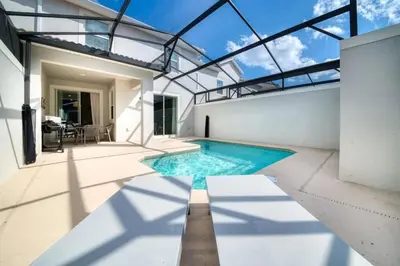 a swimming pool in a house with a glass ceiling at Casa 4 Quartos com Piscina Privativa Storey Lake in Kissimmee