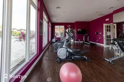 a fitness room with a gym with a exercise bike at 4BR Family Townhouse Steps to Disney in Kissimmee