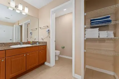 a bathroom with a sink and a toilet at Cozy Apartment w Kitchen Near Universal in Orlando