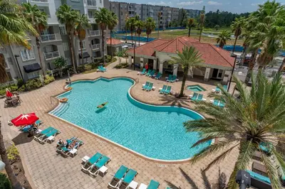 an overhead view of a swimming pool at a resort at Cozy Apartment w Kitchen Near Universal in Orlando