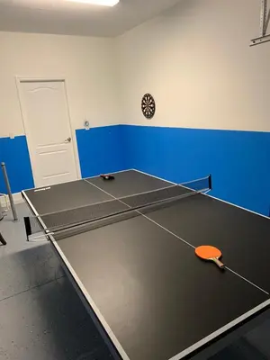 a ping pong table in a room with at Relaxing Villa very close to Disney and Universal in Kissimmee