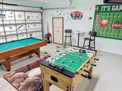 a game room with a pool table and a table at Sunny Oaks Poolside, pool spa games,4m to Disney in Orlando