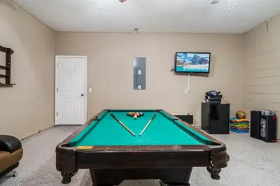 a room with a pool table in a room at 7 Bed Family Villa for All in Kissimmee