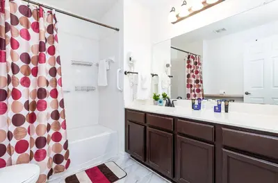 a bathroom with a sink toilet and a shower at 4 Bedroom 3 Bathroom Villas At SevenDwarfs 4-108 in Kissimmee