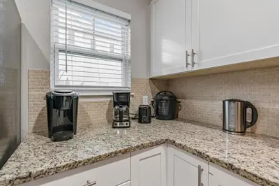 a kitchen with a counter top with appliances on it at Thematic 4 bdr near Disney-22101 in Kissimmee