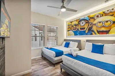 a bedroom with two beds and a painting on the wall at Thematic 4 bdr near Disney-22101 in Kissimmee
